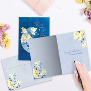 Floral card with envelope on a light surface