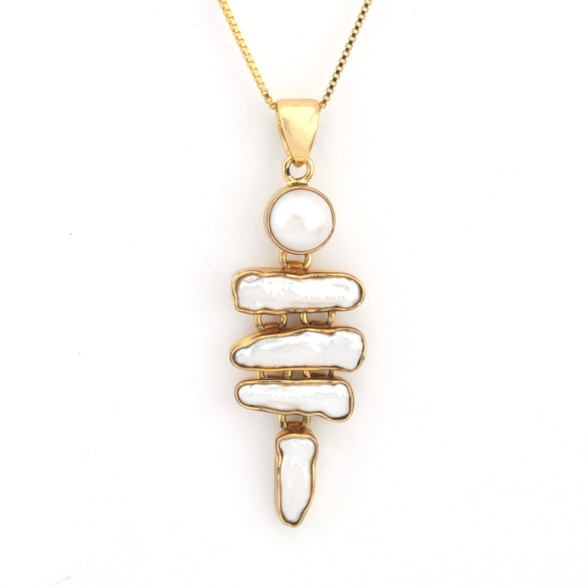 Gold necklace with a unique pendant on a white background