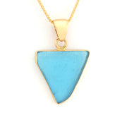 Gold necklace with a blue triangular pendant on a white background