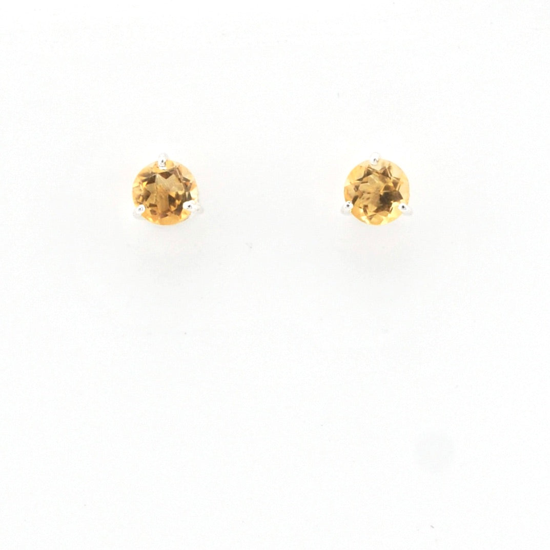 Pair of citrine round stud earrings on a white background