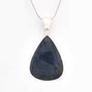 Teardrop-shaped blue pendant on a white background