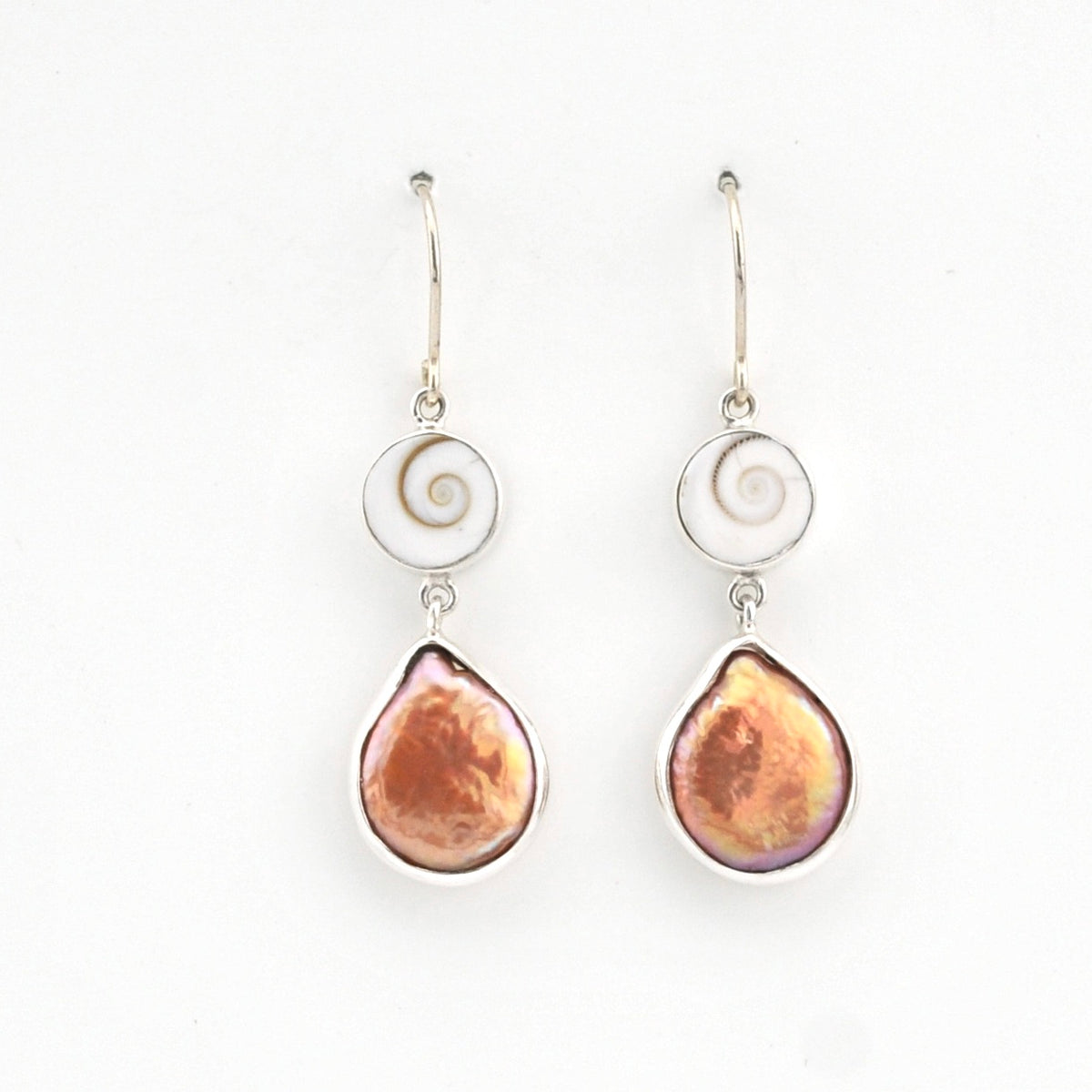 Pair of earrings with teardrop-shaped brown stones on a white background