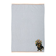 Fabric with a small dog design and geometric pattern on a white background