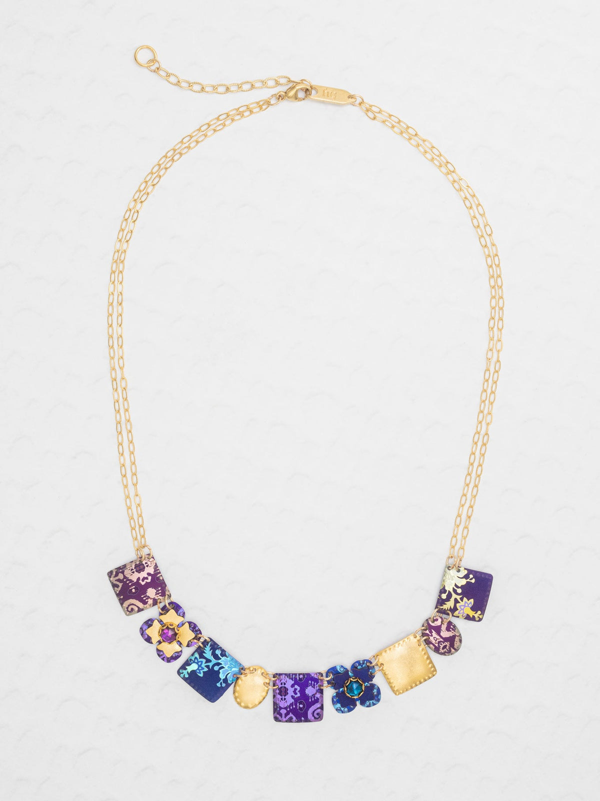 Necklace with colorful beads on a light gray background