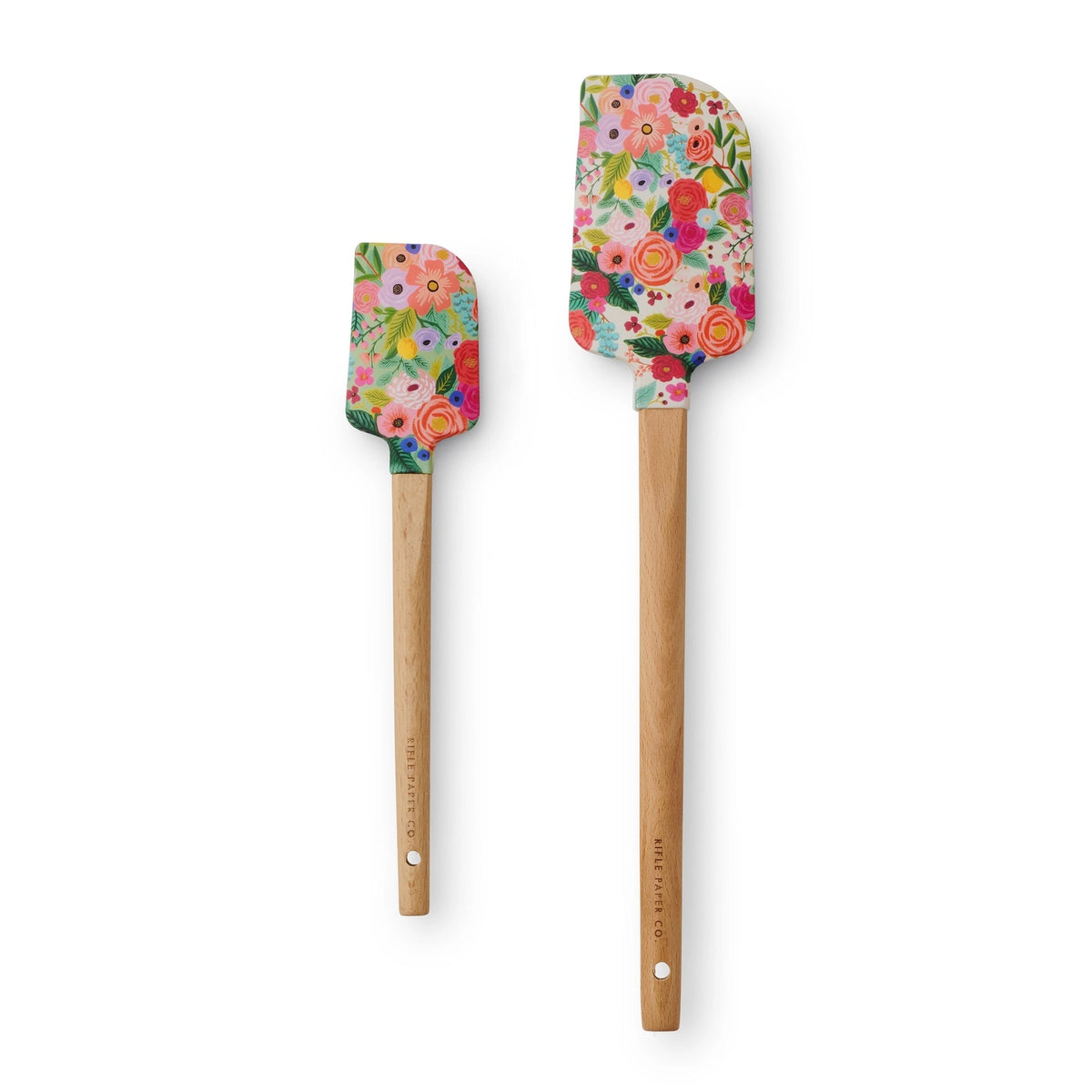 Two floral-patterned spatulas with wooden handles on a white background