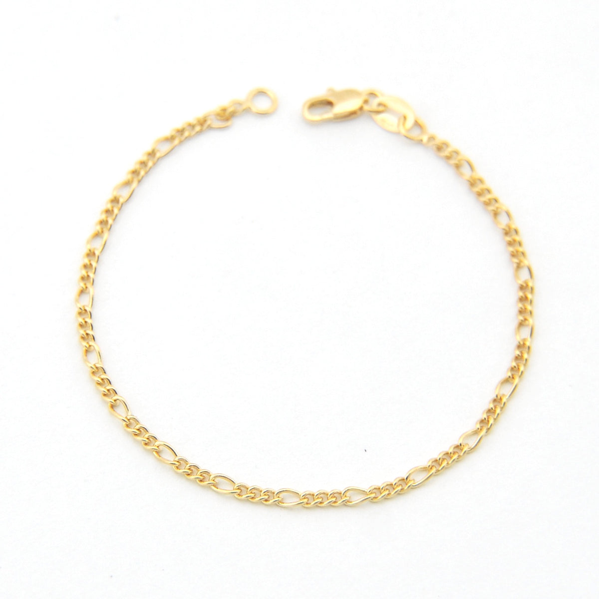Gold chain bracelet on a white background