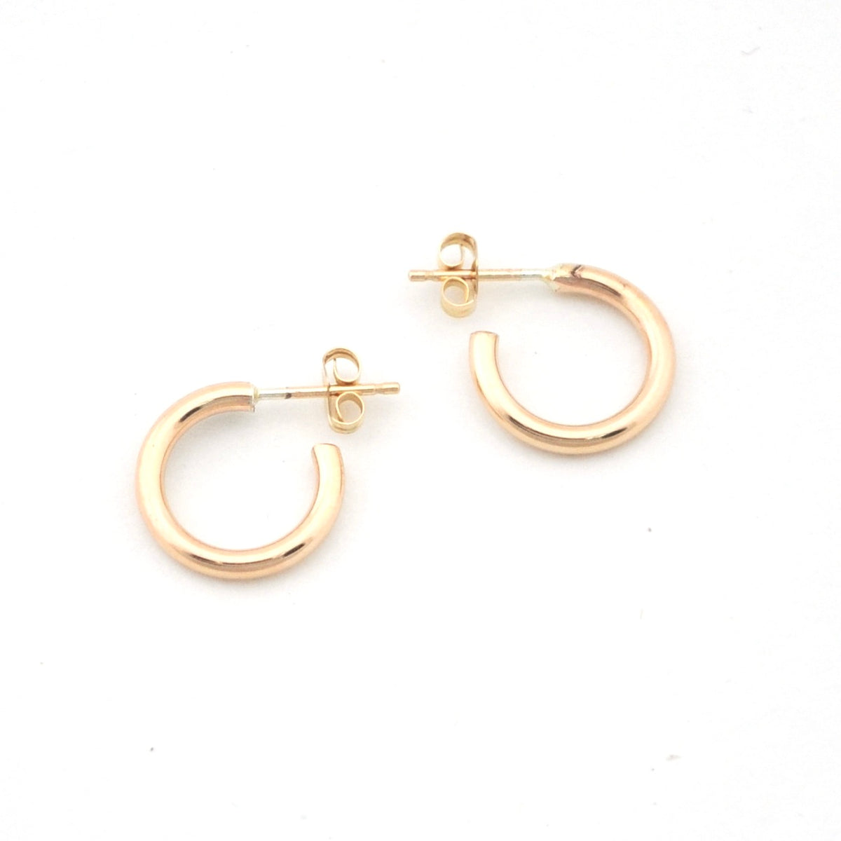 Gold hoop earrings on a white background