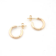 Gold hoop earrings on a white background