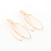 Gold earrings on a white background
