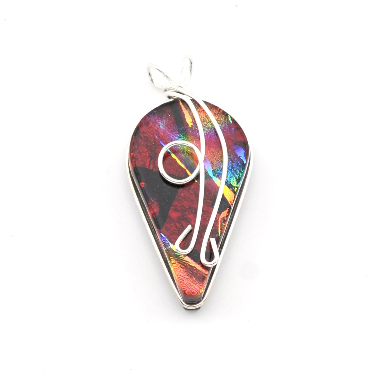 A teardrop-shaped pendant featuring a colorful iridescent dichroic glass with red, orange, green, and blue hues, wrapped with a silver-tone wire design and suspended from a matching silver bail, shown on a plain white background.