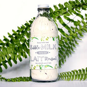 Bottle of Bubble Milk with green leafy background
