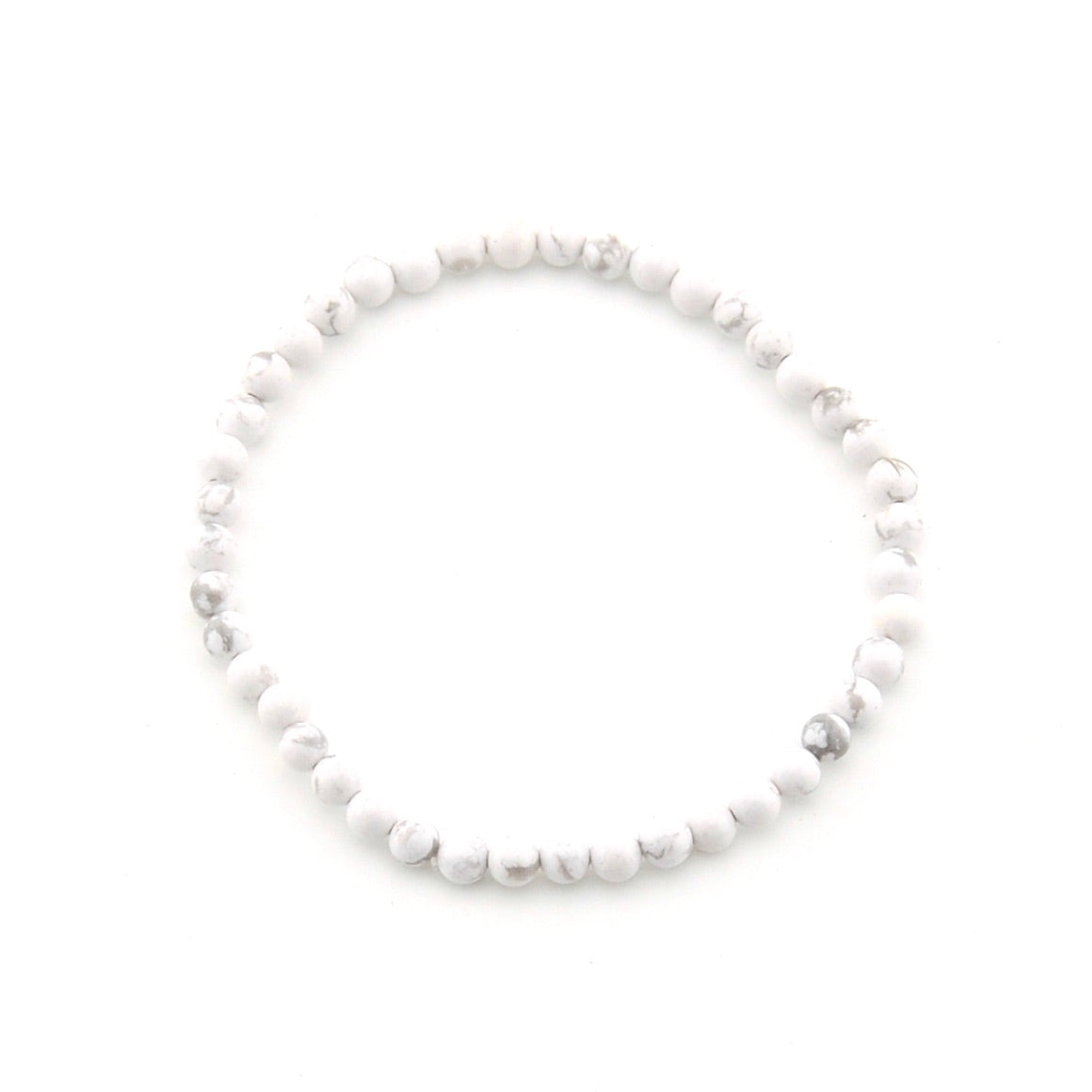 White beaded bracelet on a white background