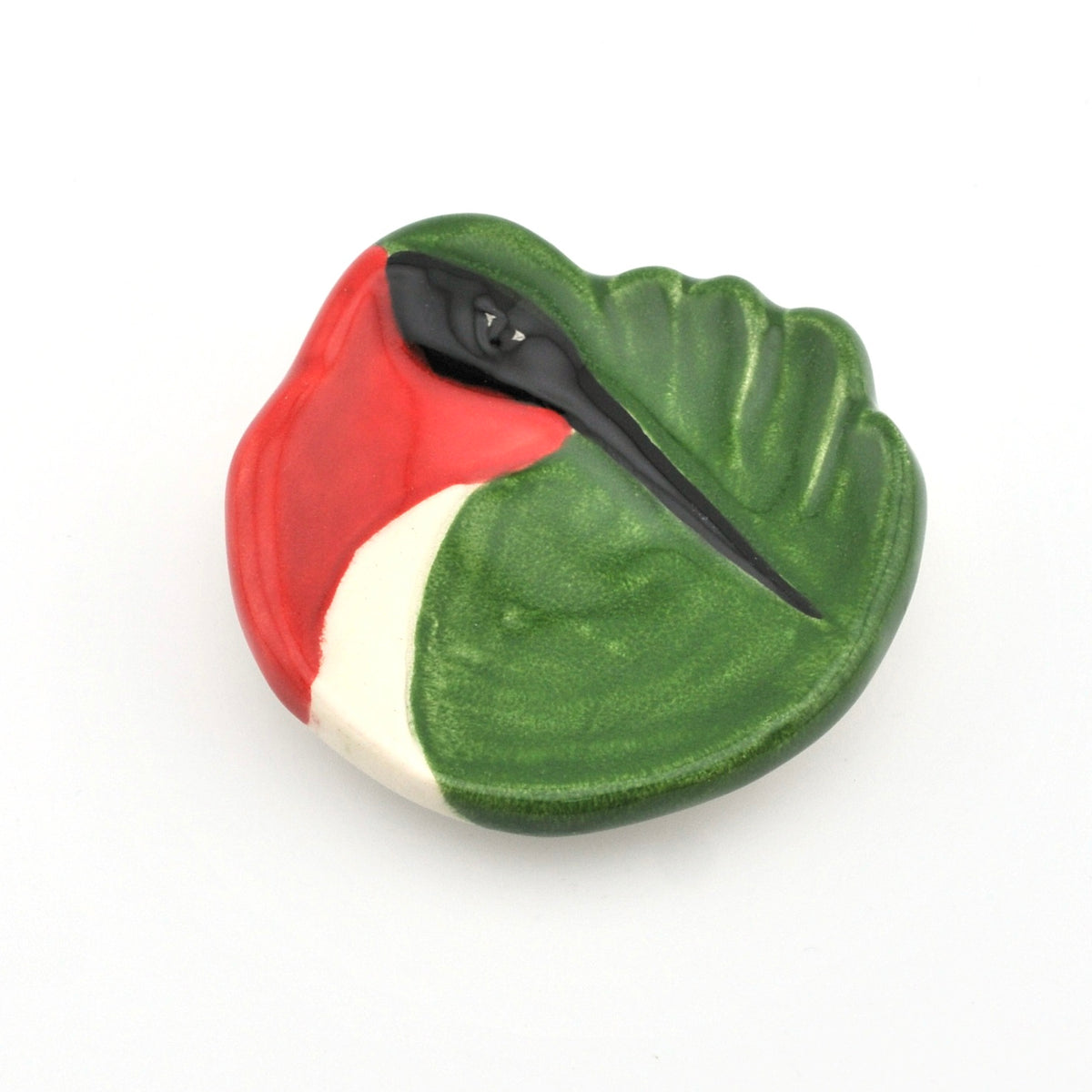 Decorative object with red, green, and white colors on a white background