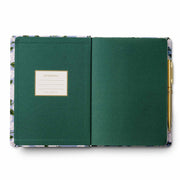 Green journal with floral edge on a white background