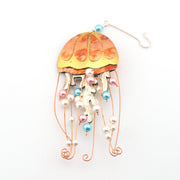 Decorative jellyfish ornament with colorful beads on a white background