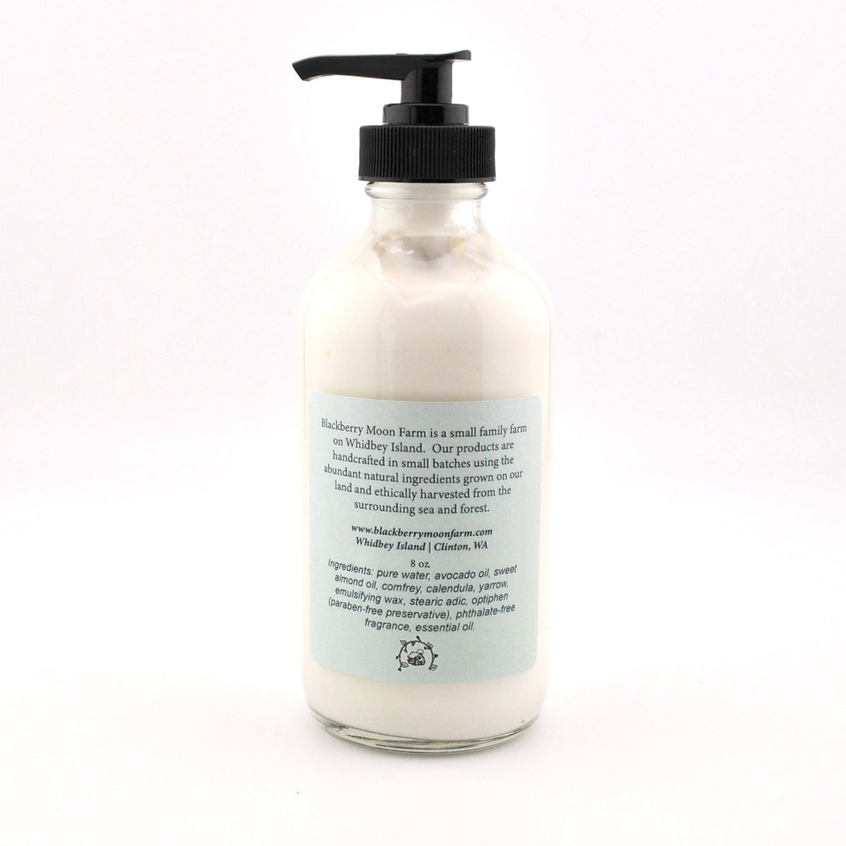 Bottle of cream with a pump on a white background