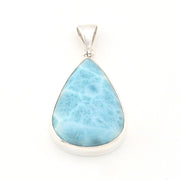 Teardrop-shaped larimar pendant on a white background