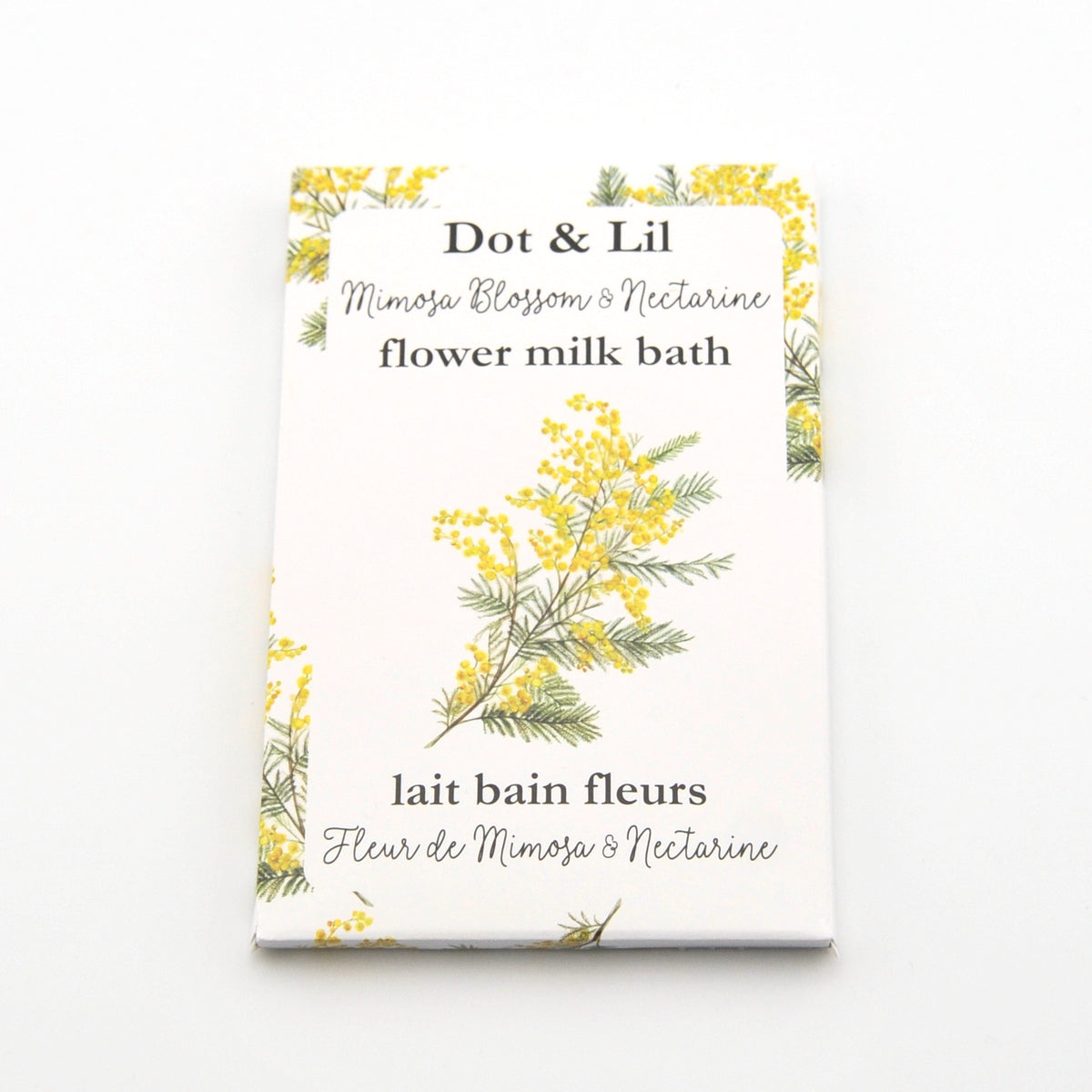 Dot & Lil flower milk bath packaging with floral design on a white background