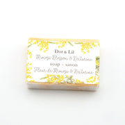 Dot & Lil Mimosa Blossom & Nectarine soap bar with floral design on a white background