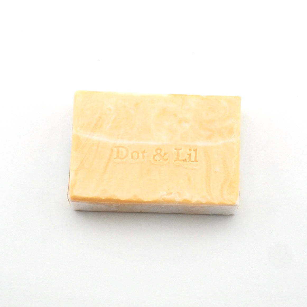 Bar of soap with 'Dot & Lil' branding on a white background