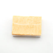 Bar of soap with 'Dot & Lil' branding on a white background