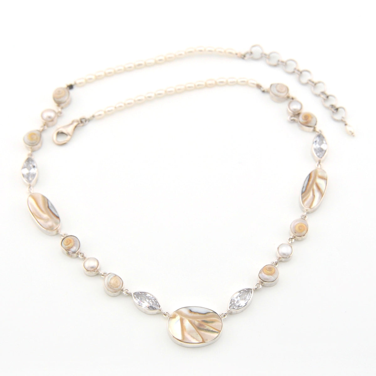 Necklace with shell and pearl on a white background