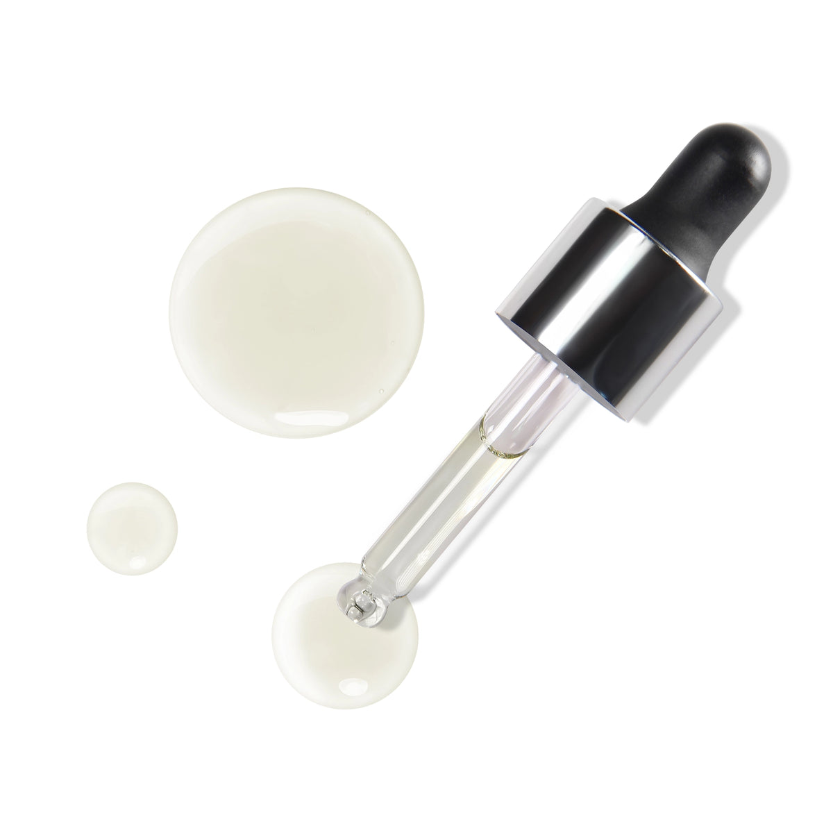 Skincare dropper with a small amount of cream on a white background