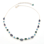 Necklace with blue and green beads on a white background