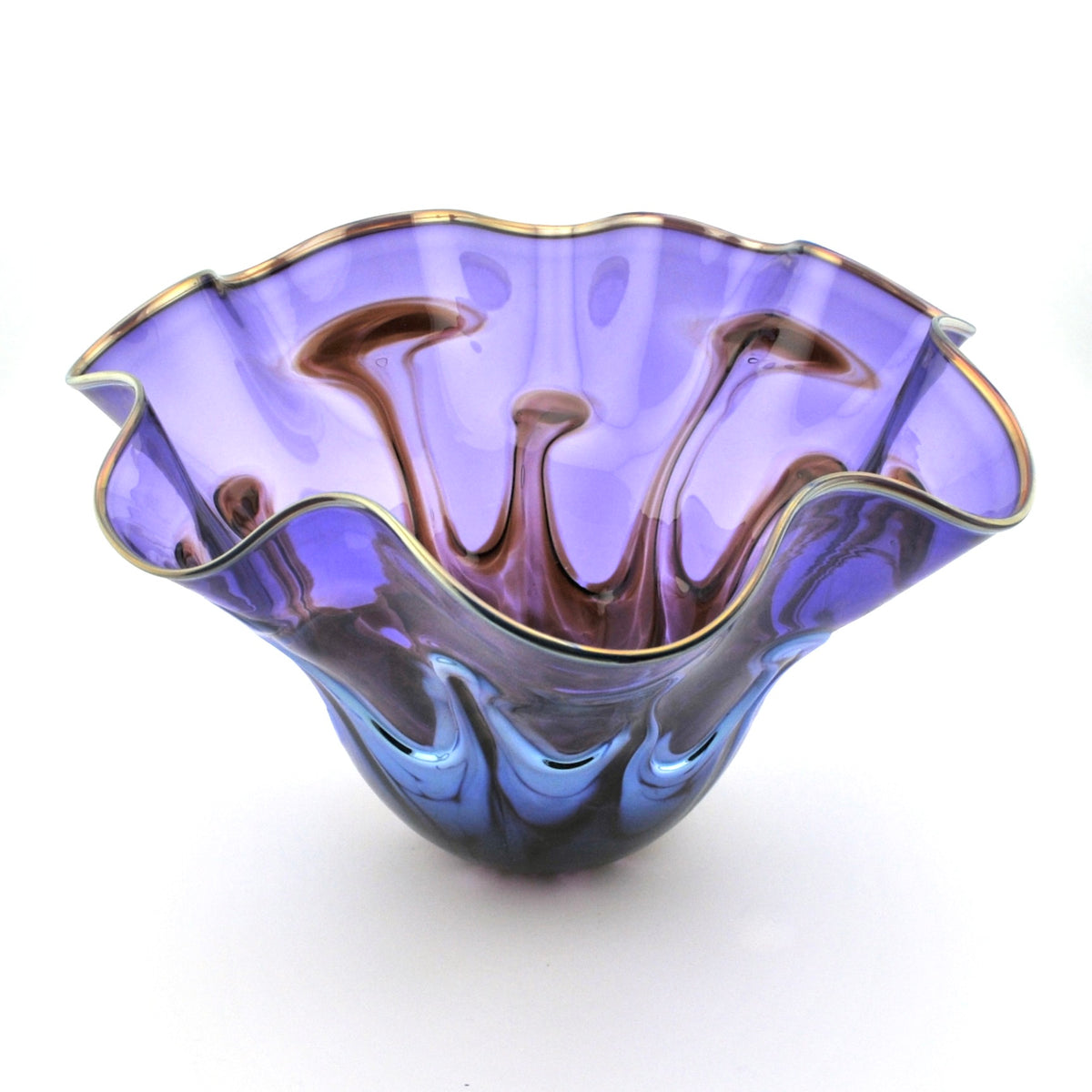 A purple and blue iridescent glass bowl with a wavy, scalloped rim and gold-toned edging, shown on a white background.