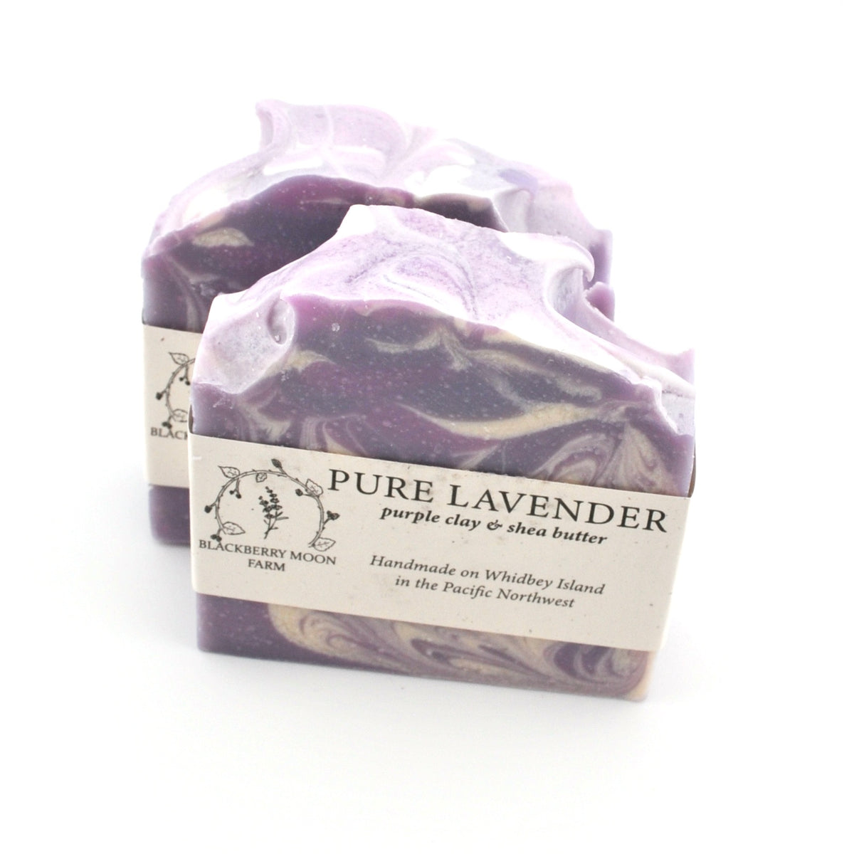 Purple and white marbled soap with a label on a white background
