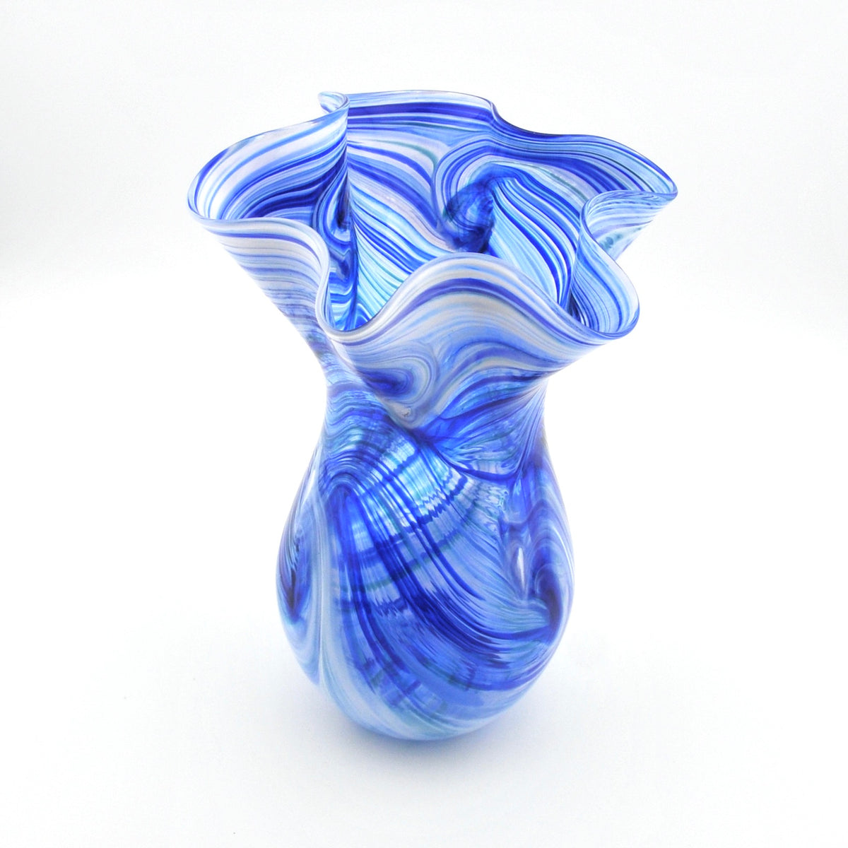 Blue and white swirled glass vase on a white background