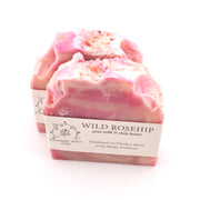Pink soap bar with a label on a white background