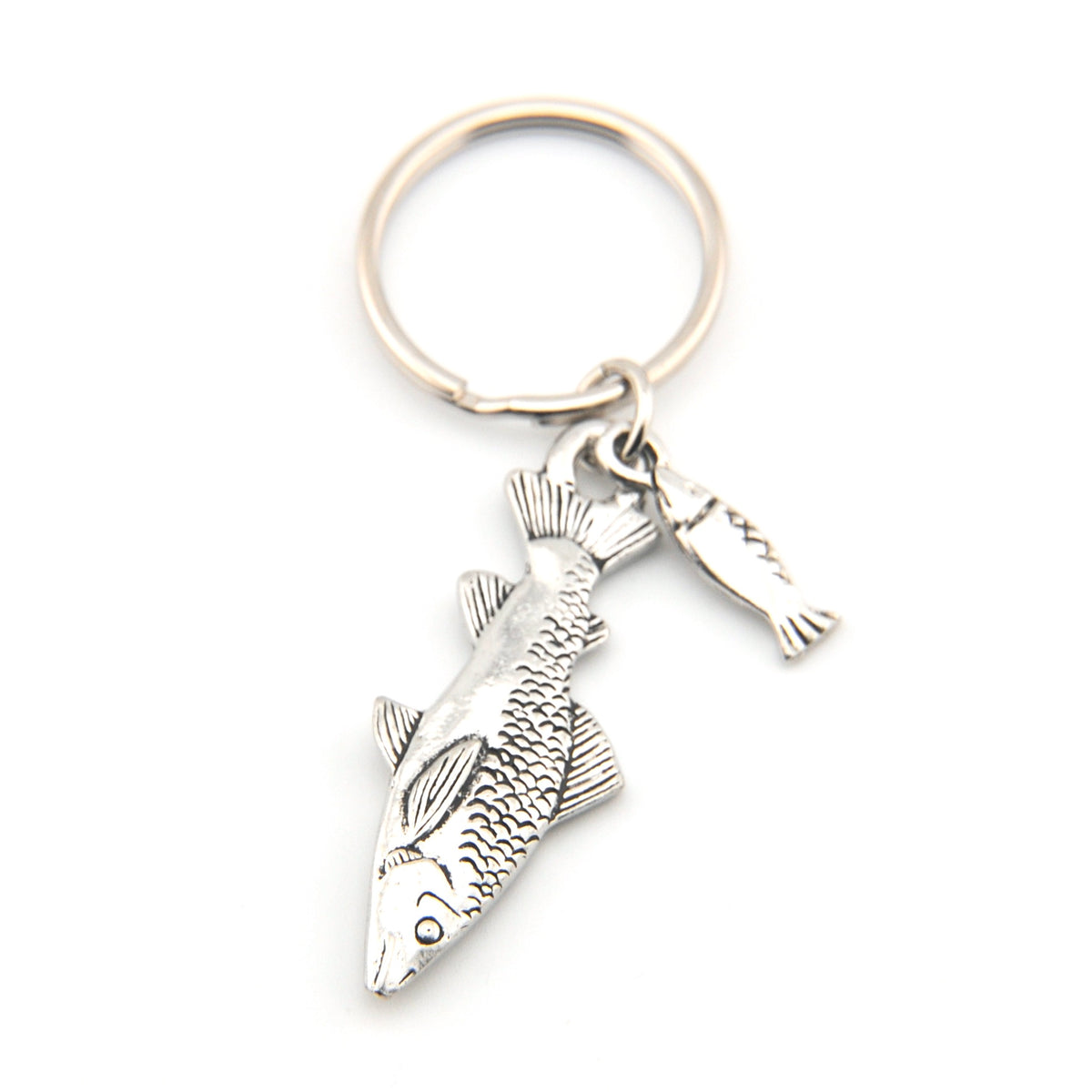 Silver fish keychain on a white background