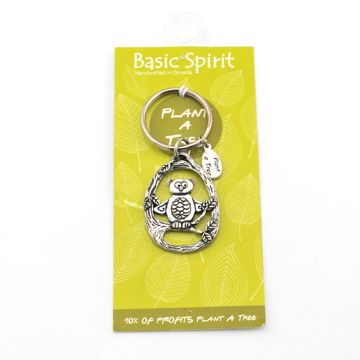 Keychain with owl design on a 'Basic Spirit' branded card with green background