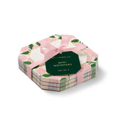 Hexagonal box of mini notepads with floral design and pink ribbon on a white background