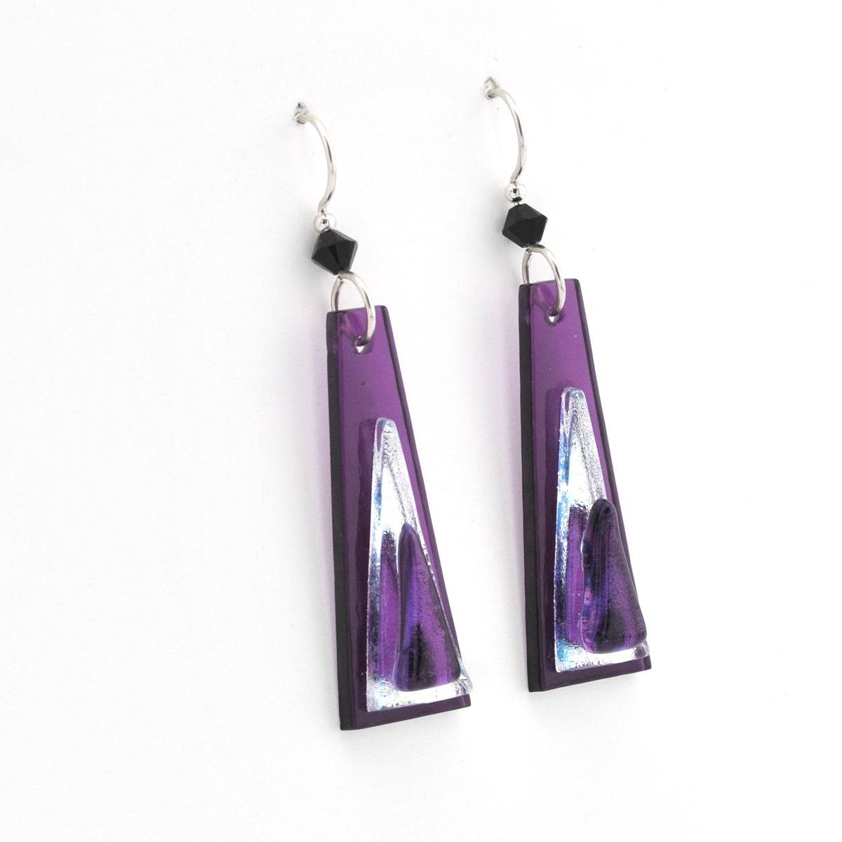 Purple and silver earrings on a white background