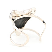 Silver bracelet with megalodon tooth on a white background