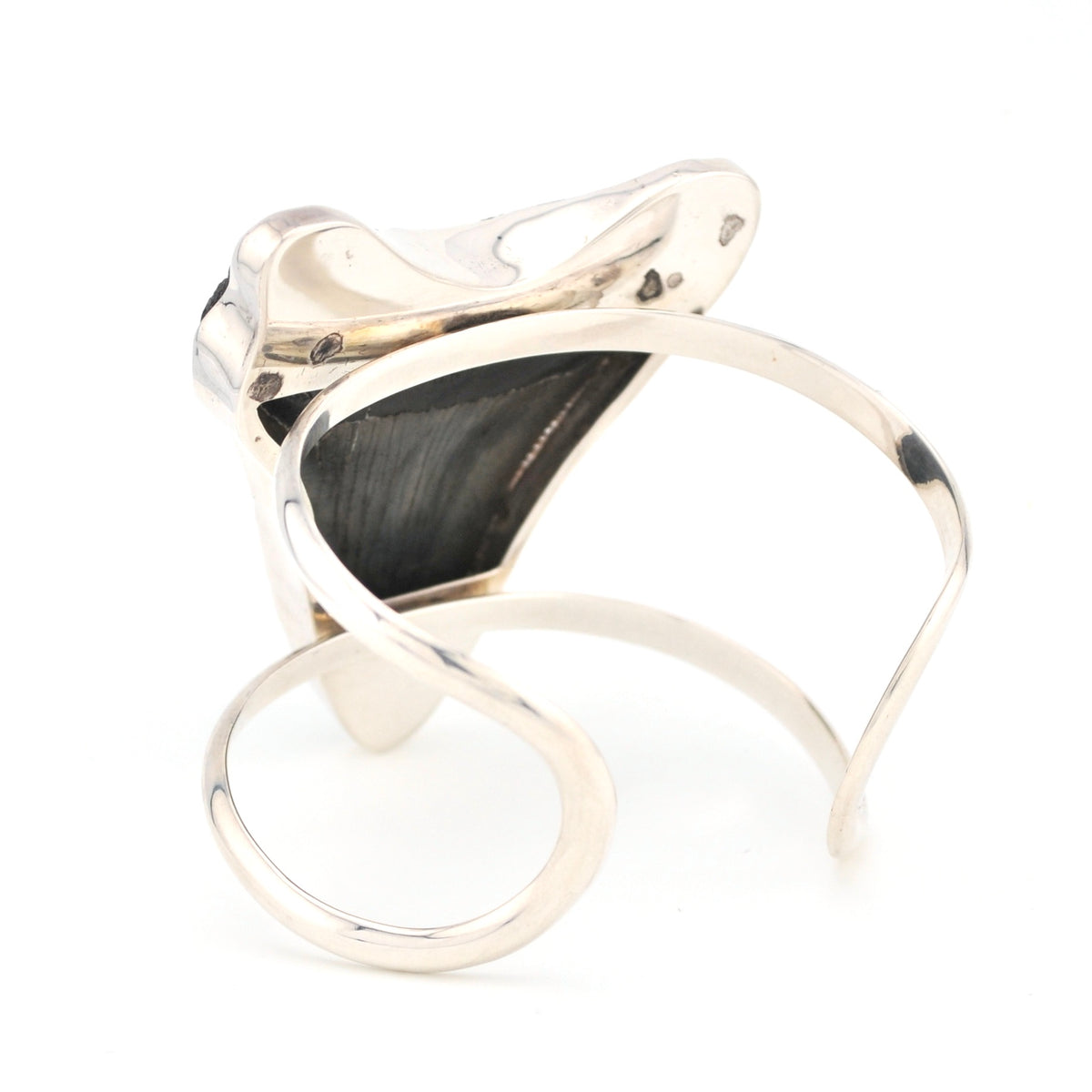 Silver bracelet with megalodon tooth on a white background