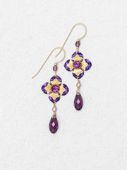 Pair of gold and purple earrings on a white background