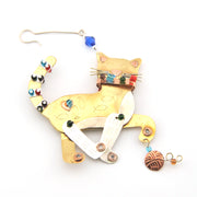 Decorative cat-shaped ornament with colorful beads on a white background
