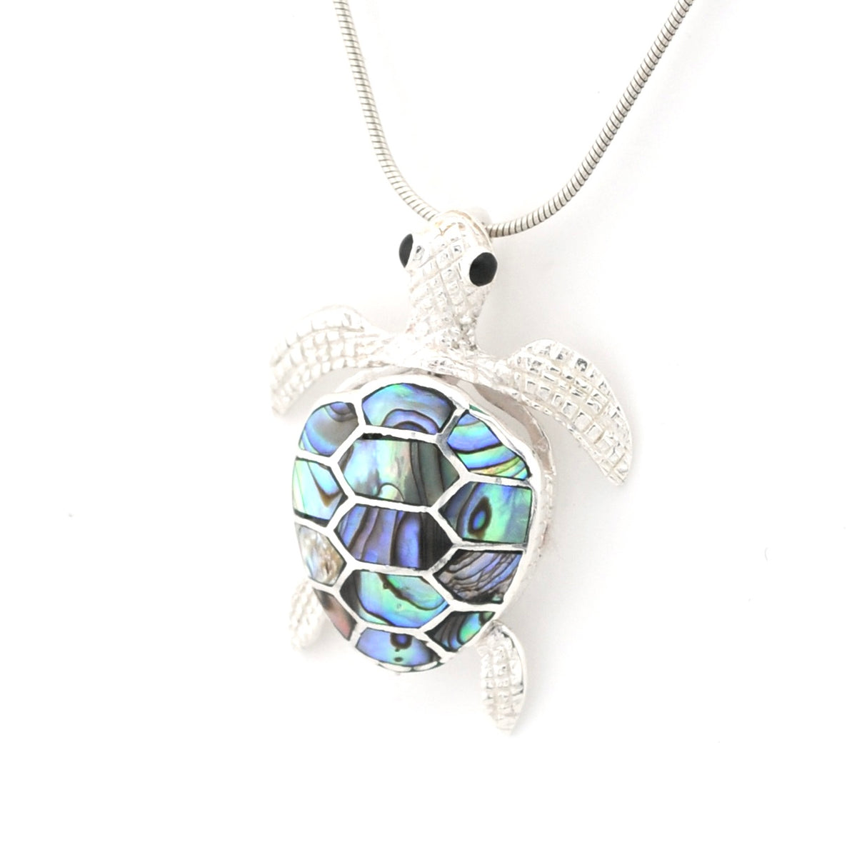 Turtle-shaped pendant with abalone shell inlay on a white background