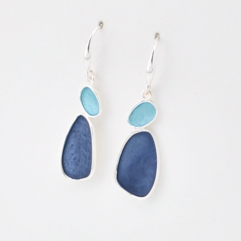 Pair of earrings with blue and silver design on a white background
