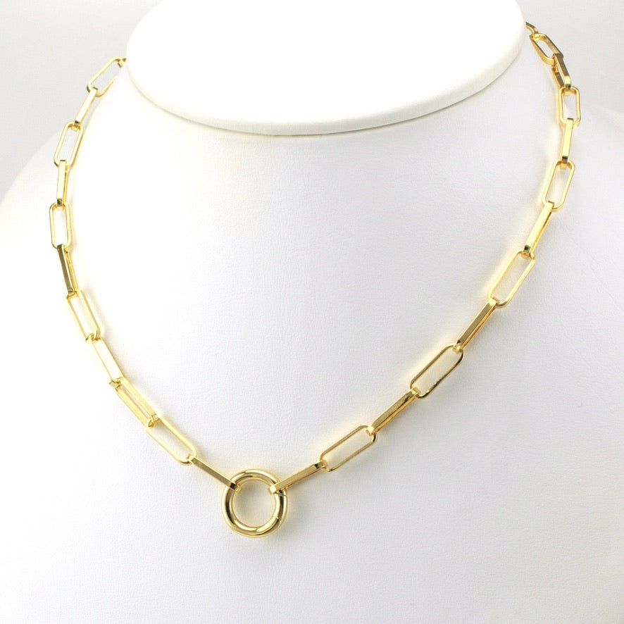 Gold chain necklace on a mannequin with a white background