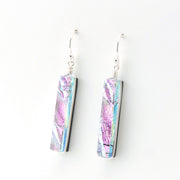 Pair of earrings with pink and blue marbled design on a white background