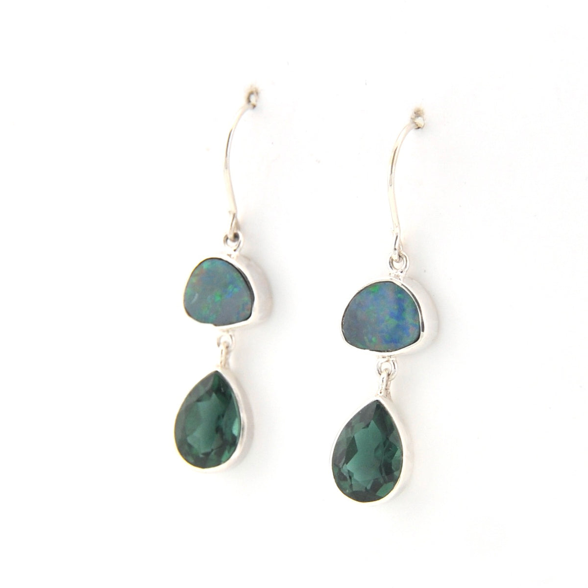 Pair of earrings with green teardrop-shaped stones on a white background