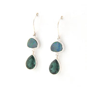Pair of earrings with green teardrop-shaped stones on a white background