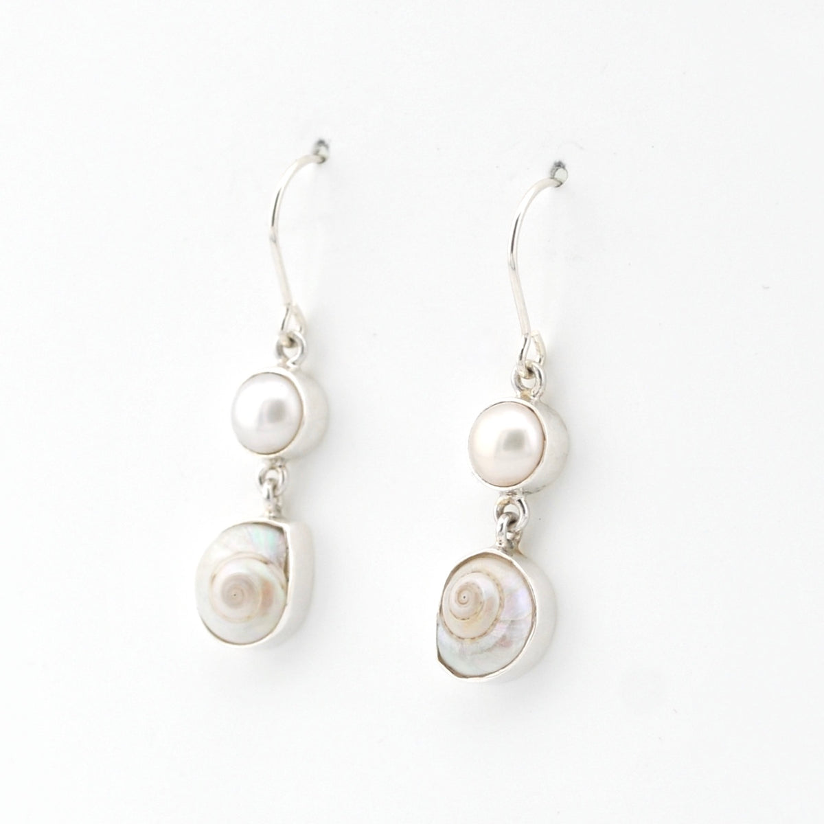 Pair of pearl earrings on a white background
