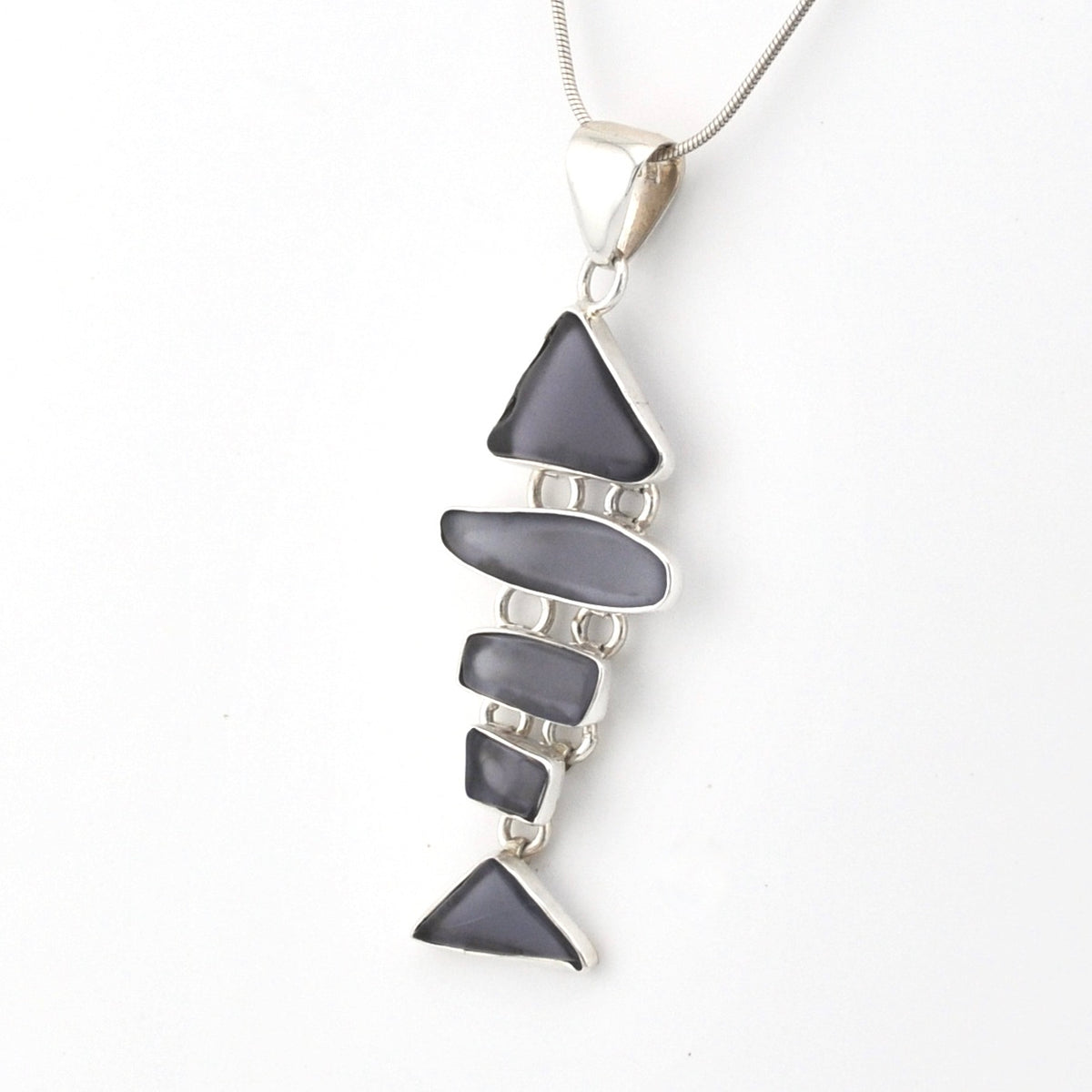 Necklace with a blue violet pendant on a white background
