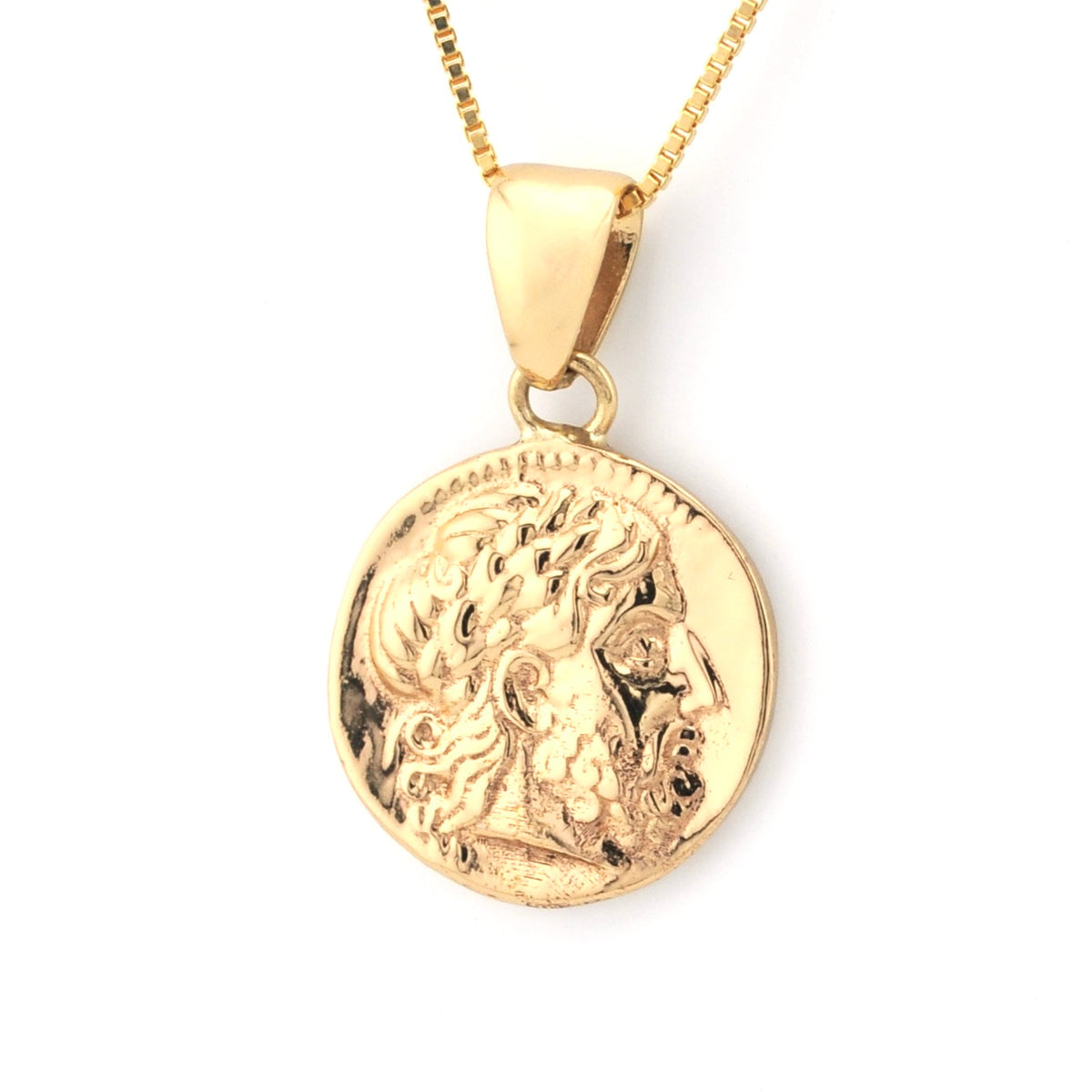 Gold pendant necklace with a detailed design on a white background
