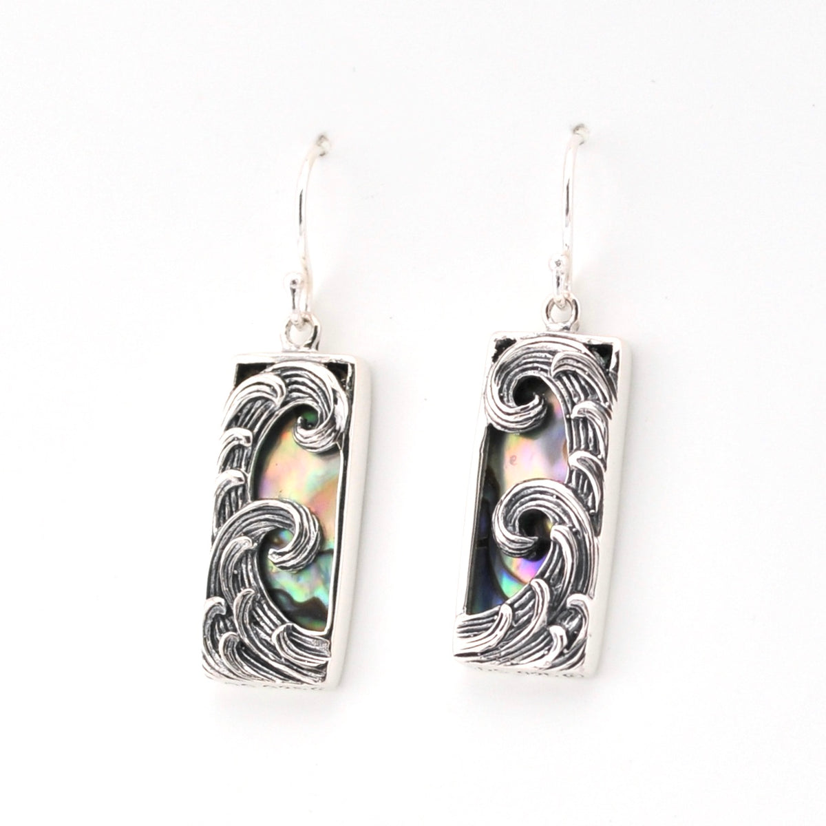 Pair of earrings with wave design on a white background